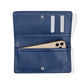 Brighton wallet shown open with navy pebbled leather interior, card slots, and phone pocket on a white background