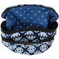 Brighton cosmetic bag shown open with navy Celtic knot print exterior and polka dot interior lining on a white background