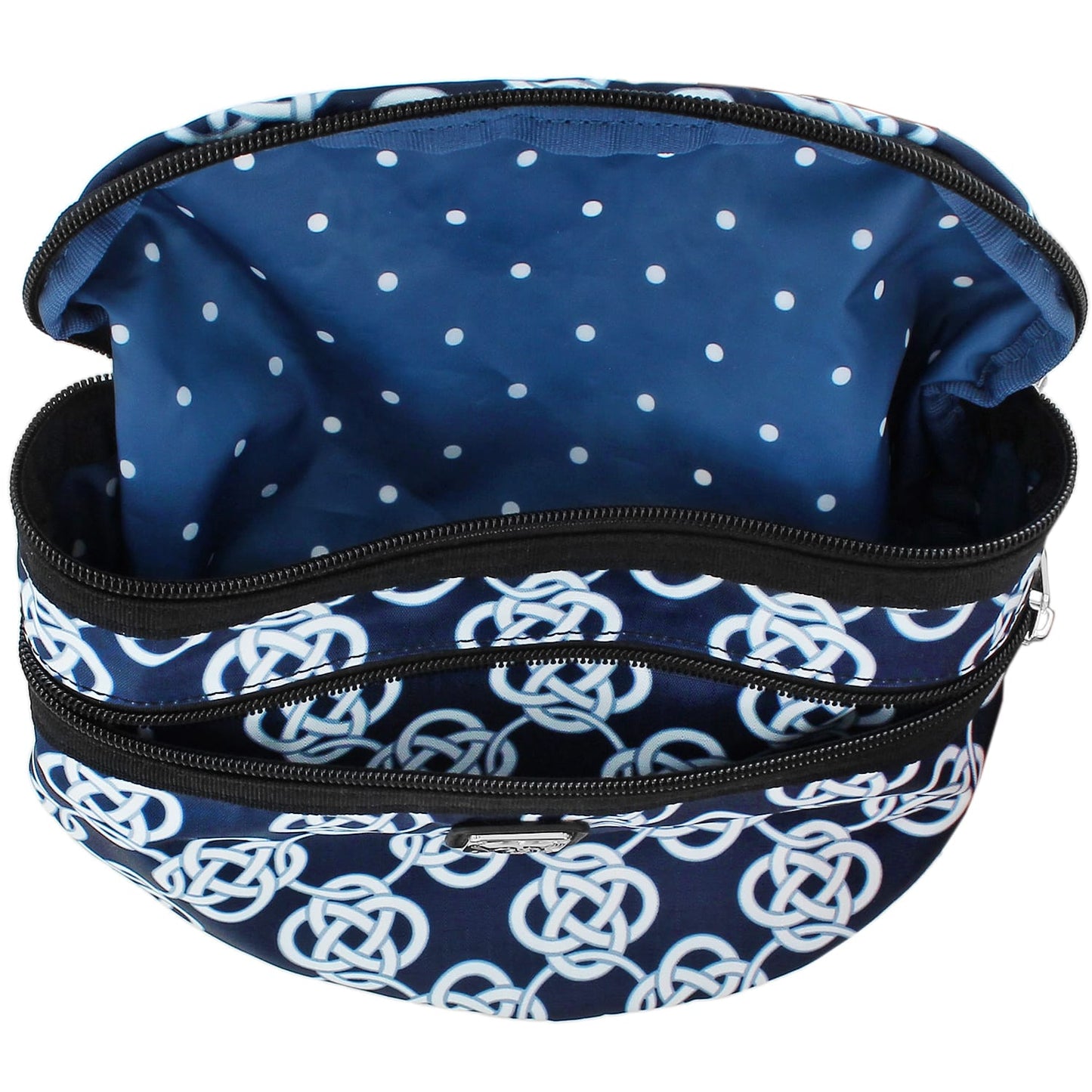 Brighton cosmetic bag shown open with navy Celtic knot print exterior and polka dot interior lining on a white background