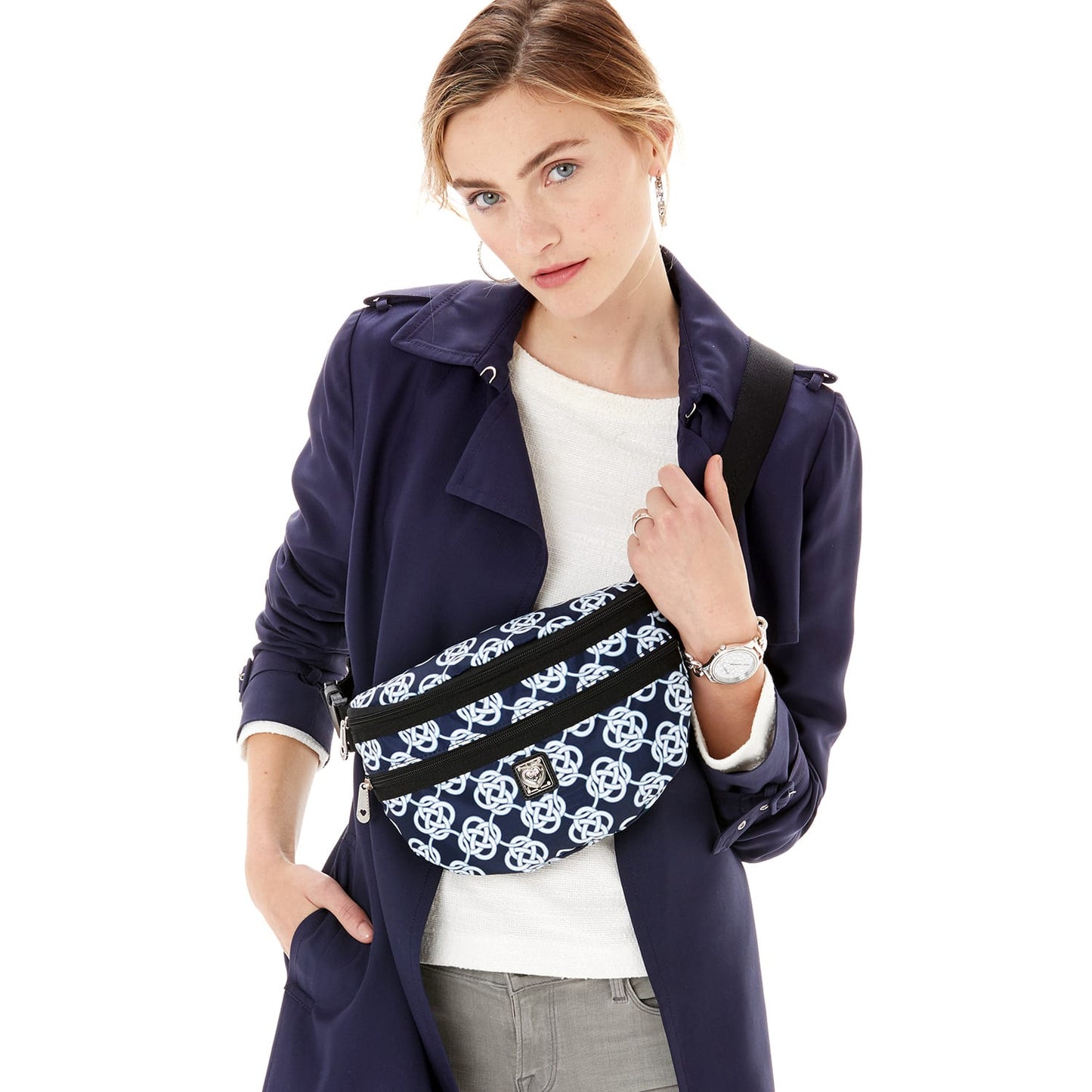 Model with a Brighton belt bag in navy and white geometric print with black adjustable strap