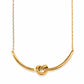 Brighton necklace with gold-plated curved bar pendant featuring a center knot detail and delicate chain on a white background