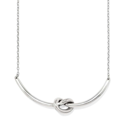 Brighton necklace with curved silver-tone bar featuring a center knot detail and delicate chain on a white background