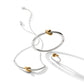 Brighton two-tone jewelry set styled with silver bangle, necklace, and ring featuring gold knot accents on white background