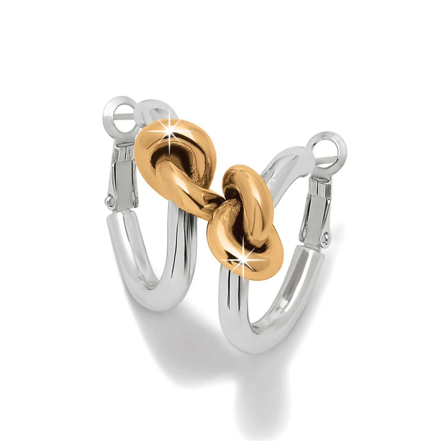 Brighton hoop earrings with silver-tone hoops and two-tone gold knot accents on a white background