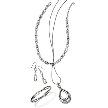 Brighton silver-plated jewelry set styled with infinity link necklace, teardrop pendant, drop earrings, and bangle bracelet