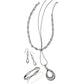 Brighton silver-plated jewelry set styled with infinity link necklace, drop earrings, bangle bracelet, and teardrop pendant necklace