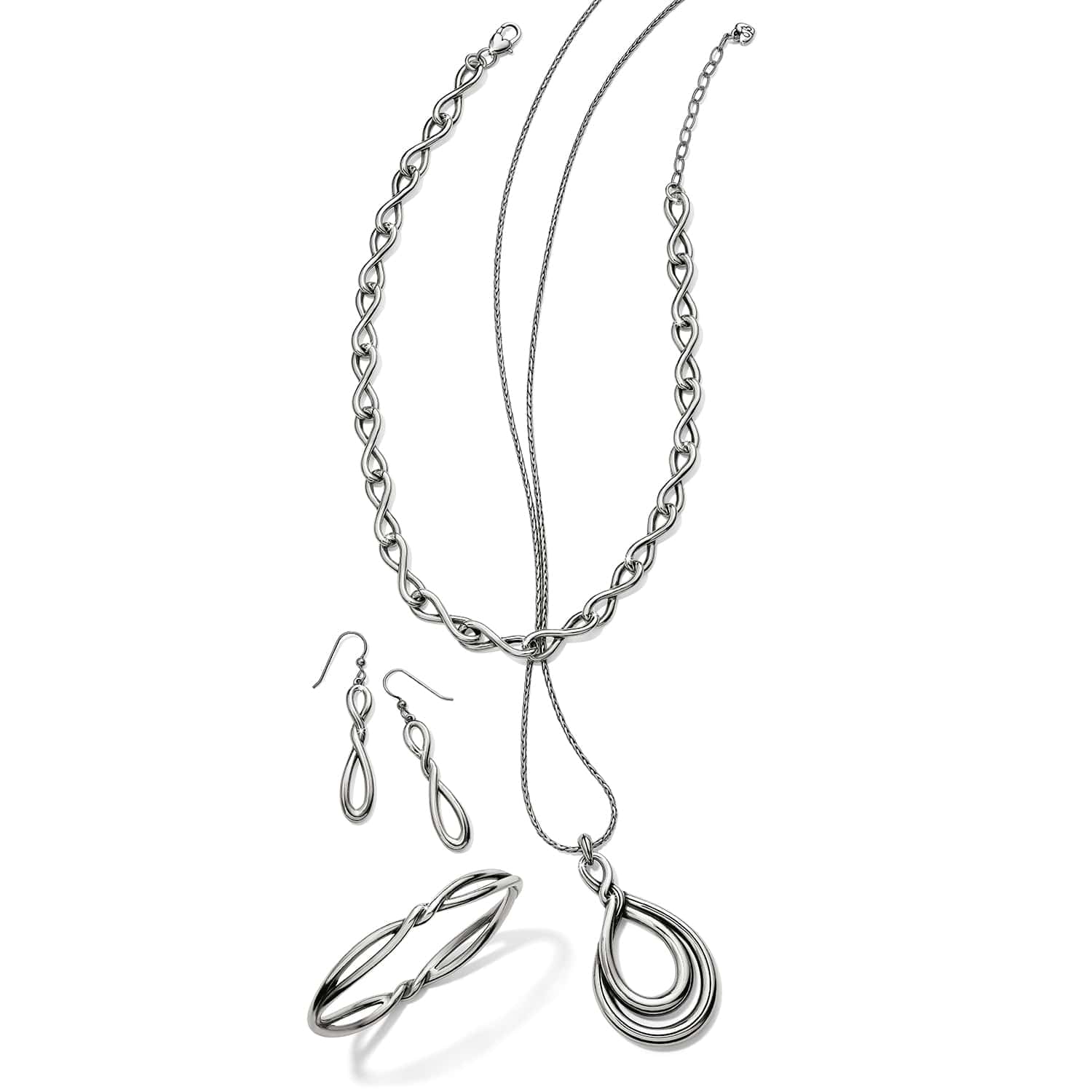 Brighton silver-plated jewelry set styled with infinity link necklace, drop earrings, bangle bracelet, and teardrop pendant necklace