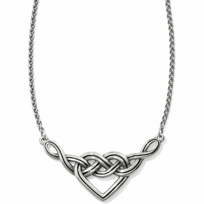 Brighton necklace with silver-plated interwoven Celtic knot heart pendant and rope chain on a white background