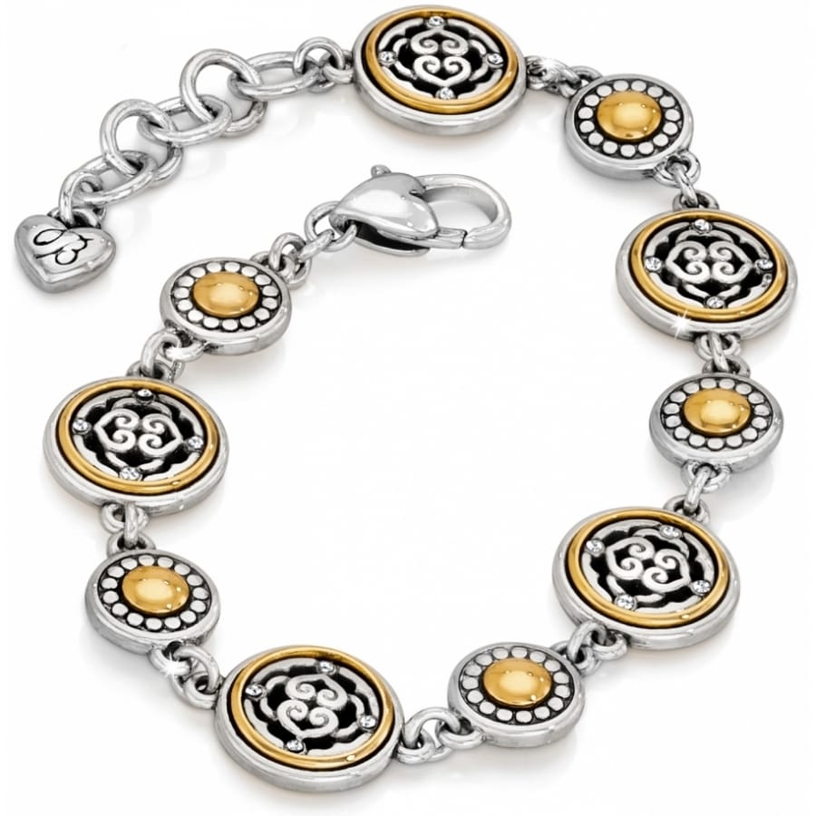 Brighton bracelet with silver-plated and gold-plated medallion links featuring scroll motifs and crystal accents on a white background