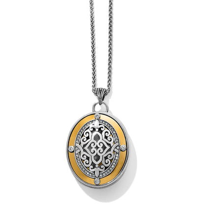 Brighton pendant necklace with two-tone oval medallion, scrollwork center, and crystal accents on a white background