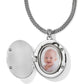 Brighton oval locket necklace shown open with baby photo inside and silver-tone wheat chain on a white background