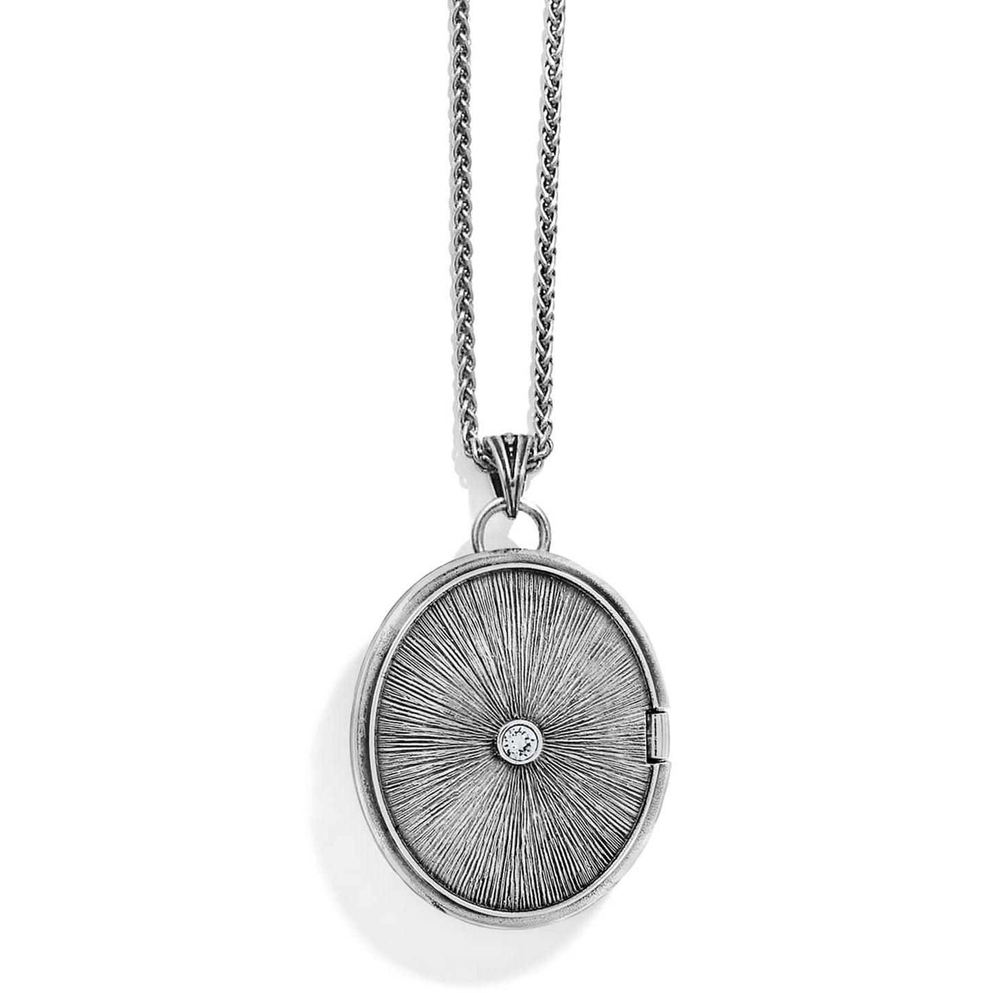 Brighton oval locket pendant necklace with silver-tone sunburst design and center crystal accent on a white background