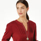 Model wearing a Brighton two-tone oval pendant necklace with ornate filigree design paired with matching stud earrings