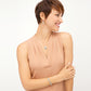 Model wearing a Brighton silver-plated medallion pendant necklace with coordinating Brighton earrings and bracelet accessories
