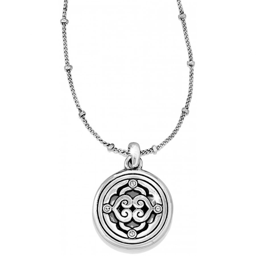 Brighton pendant necklace with silver-plated round medallion, scrollwork detail, crystal accents, and beaded chain on a white background