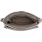 Close-up of Brighton handbag interior view showing taupe patterned lining, zippered pockets, and silver-tone hardware