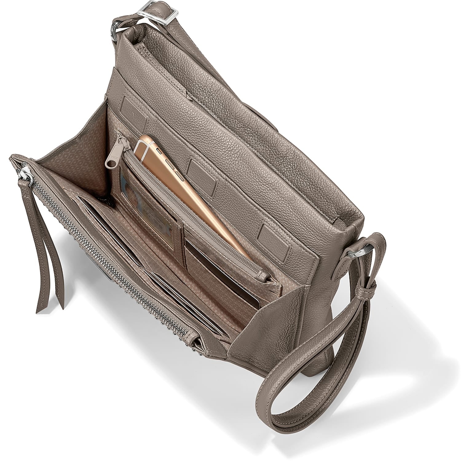 Brighton taupe pebbled leather crossbody handbag shown open with interior card slots, phone pocket, and adjustable strap on a white background