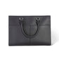 Brighton handbag in black pebbled leather with dual rolled top handles and silver-tone hardware on a white background