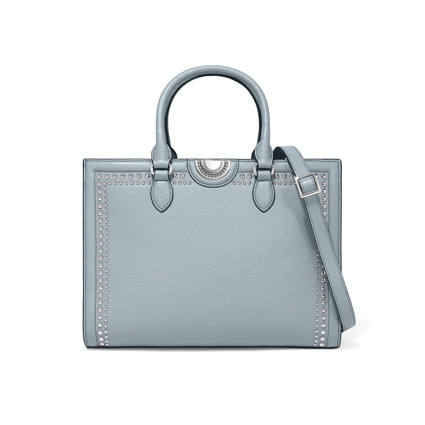 Brighton handbag in light blue leather with silver-tone stud trim, dual top handles, and adjustable crossbody strap on a white background