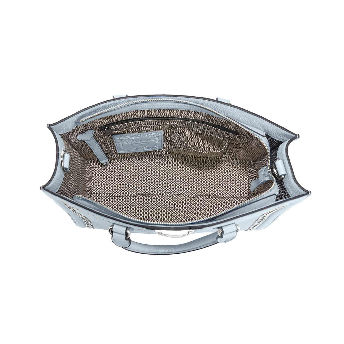 Brighton handbag interior view in light blue leather with patterned fabric lining and zip pocket on a white background