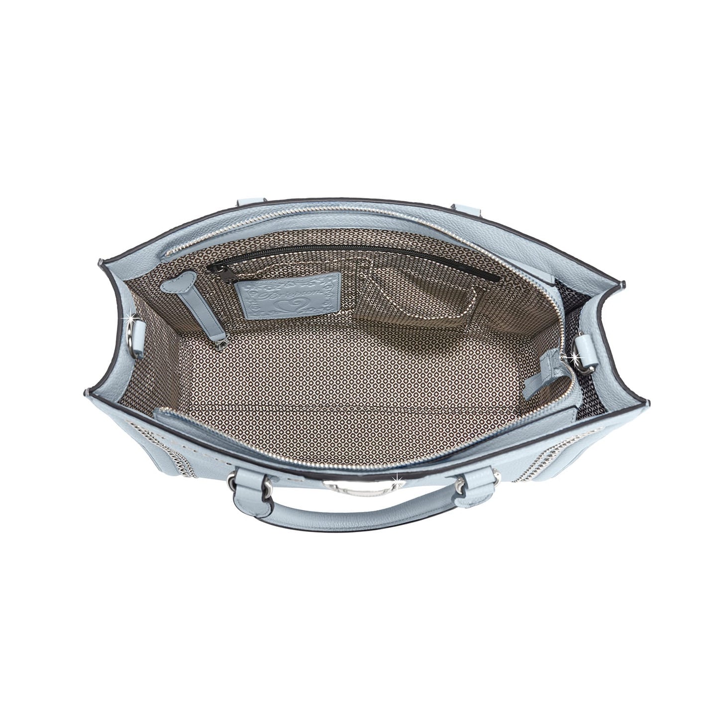 Brighton handbag interior view in light blue leather with patterned fabric lining and zip pocket on a white background