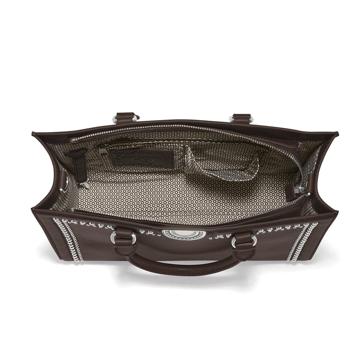 Brighton brown leather handbag interior view with patterned fabric lining, silver-tone studs, and zip pocket on a white background