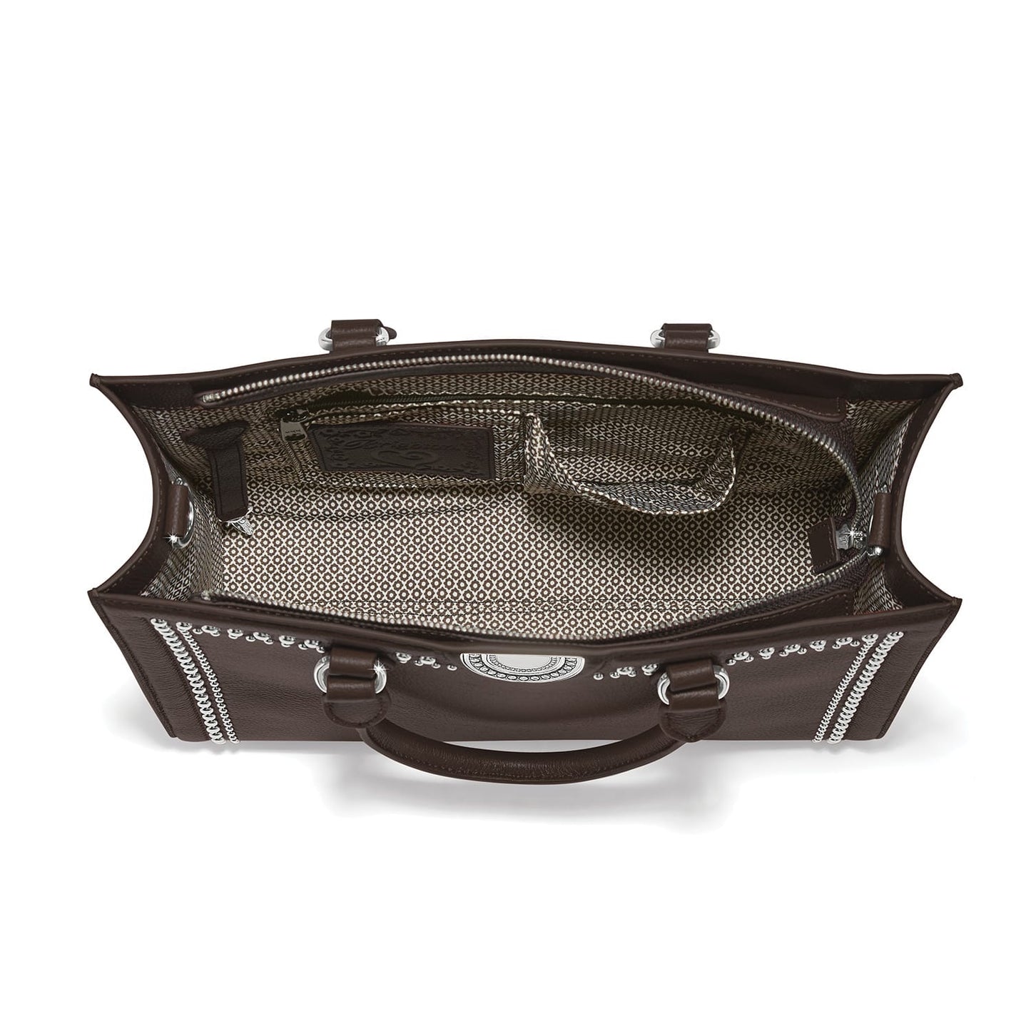 Brighton brown leather handbag interior view with patterned fabric lining, silver-tone studs, and zip pocket on a white background