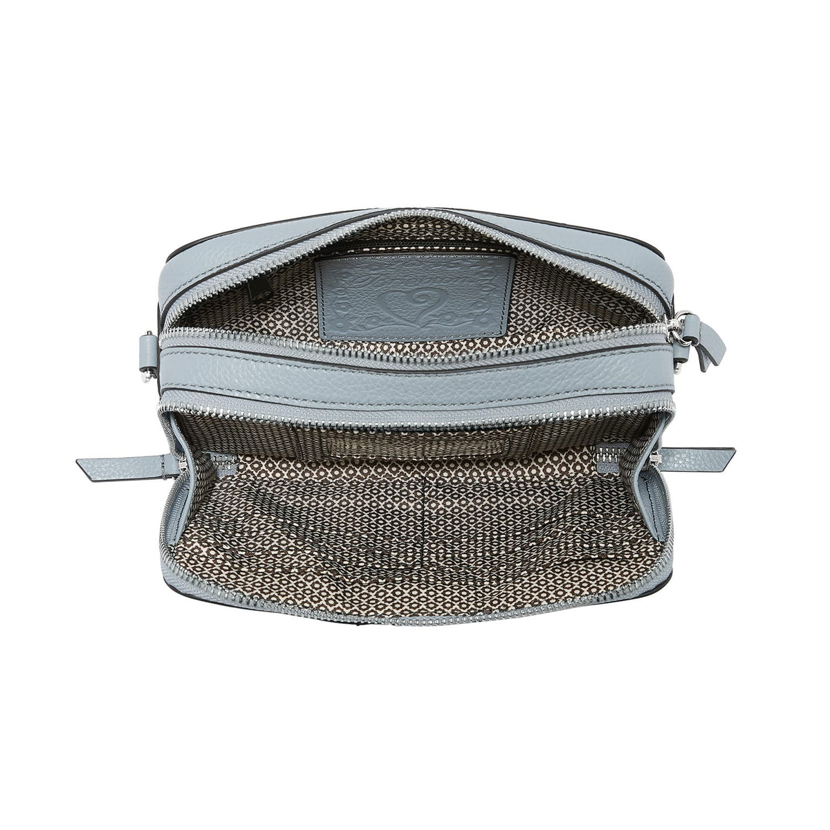 Brighton handbag shown open with light blue leather trim and patterned fabric interior lining on a white background