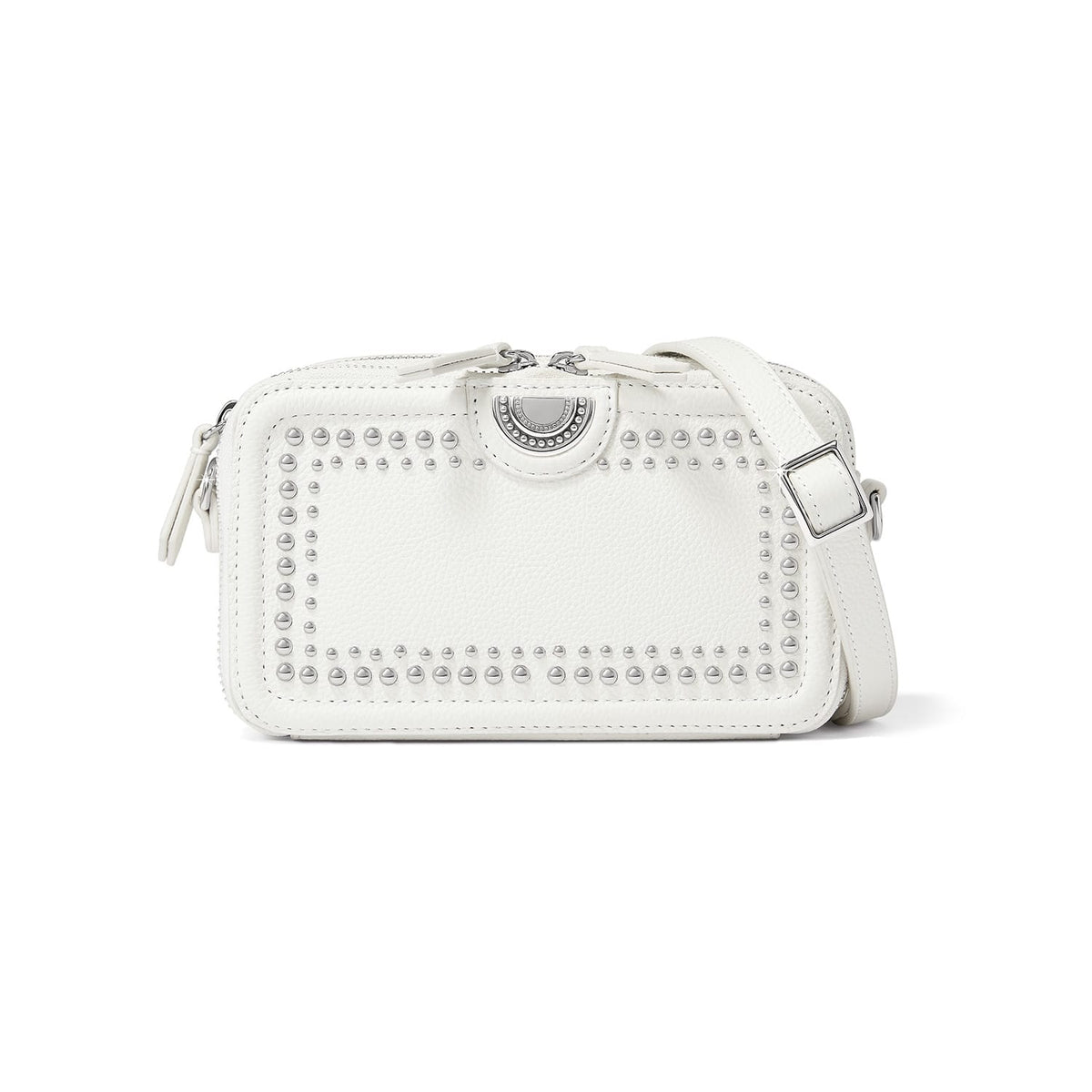 Brighton white leather crossbody handbag with silver-tone studded border, medallion accent, and adjustable strap on a white background