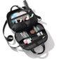 Brighton travel cosmetic case shown open with heart-print interior holding brushes, bottles, and beauty items on a white background