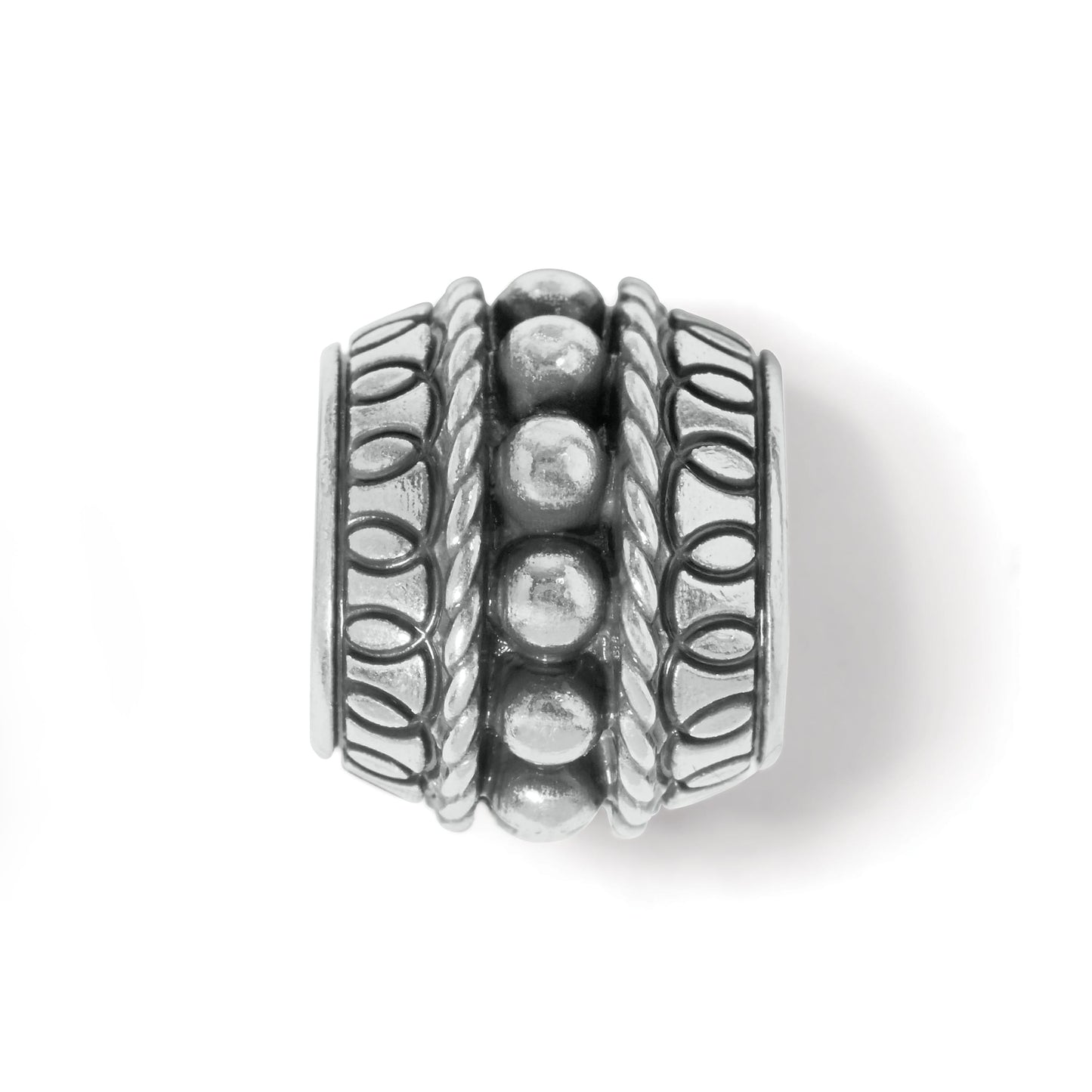 Brighton silver-plated barrel bead charm with beaded center row and rope and oval patterned borders on a white background