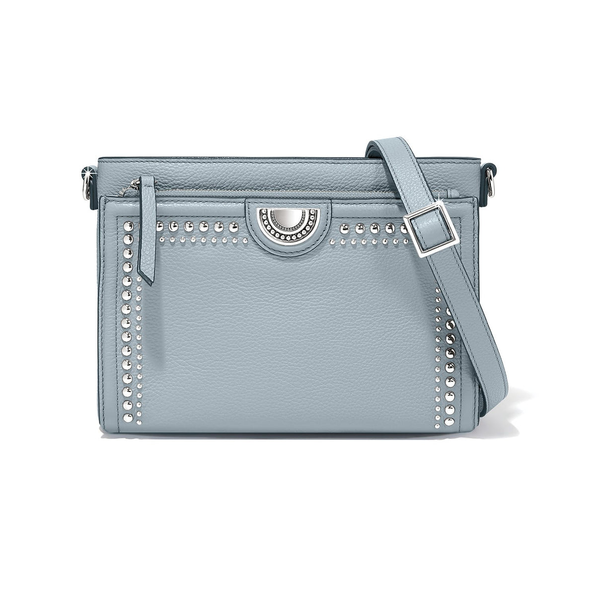 Brighton crossbody handbag in light blue leather with silver-tone studs and adjustable strap on a white background