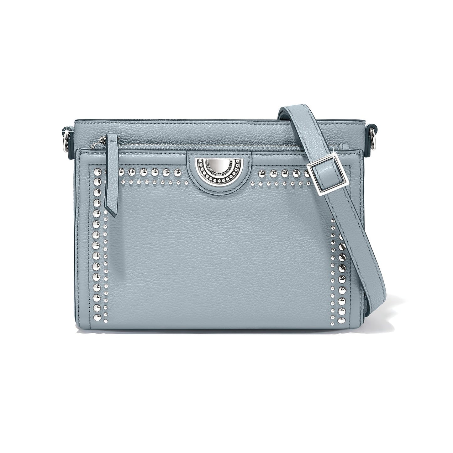Brighton crossbody handbag in light blue leather with silver-tone studs and adjustable strap on a white background
