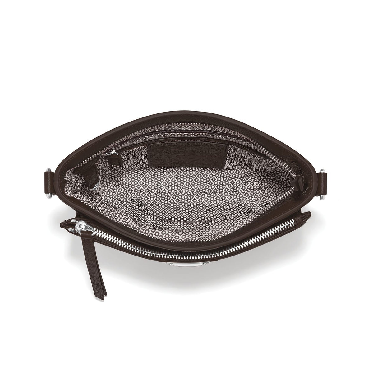 Brighton handbag interior view showing patterned fabric lining, zippered pocket, and silver-tone zipper hardware on a white background