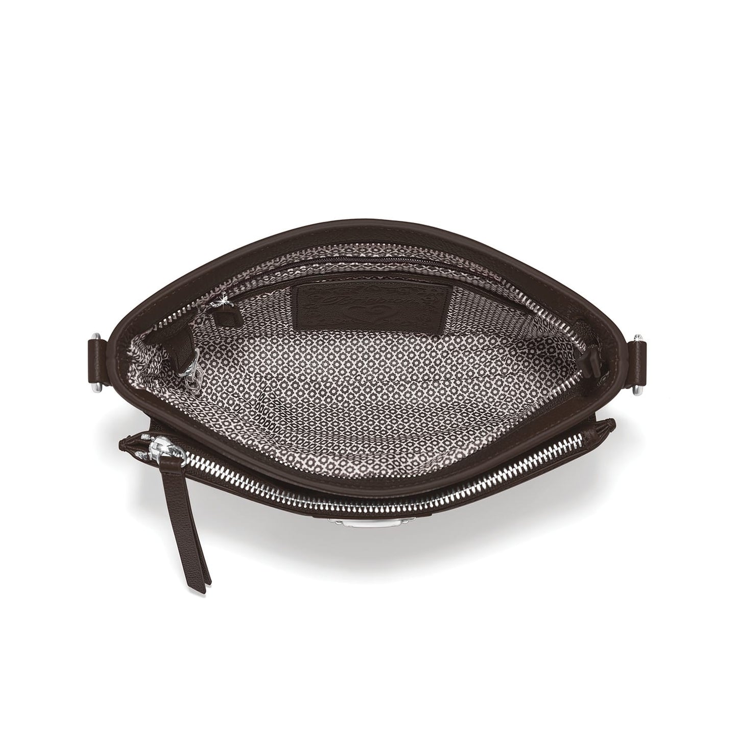 Brighton handbag interior view showing patterned fabric lining, zippered pocket, and silver-tone zipper hardware on a white background