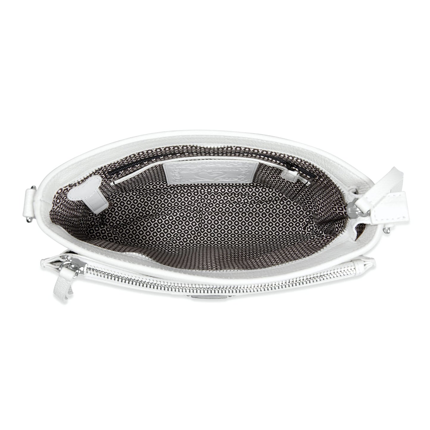 Close-up of Brighton white leather handbag interior view showing patterned fabric lining and silver-tone zipper hardware
