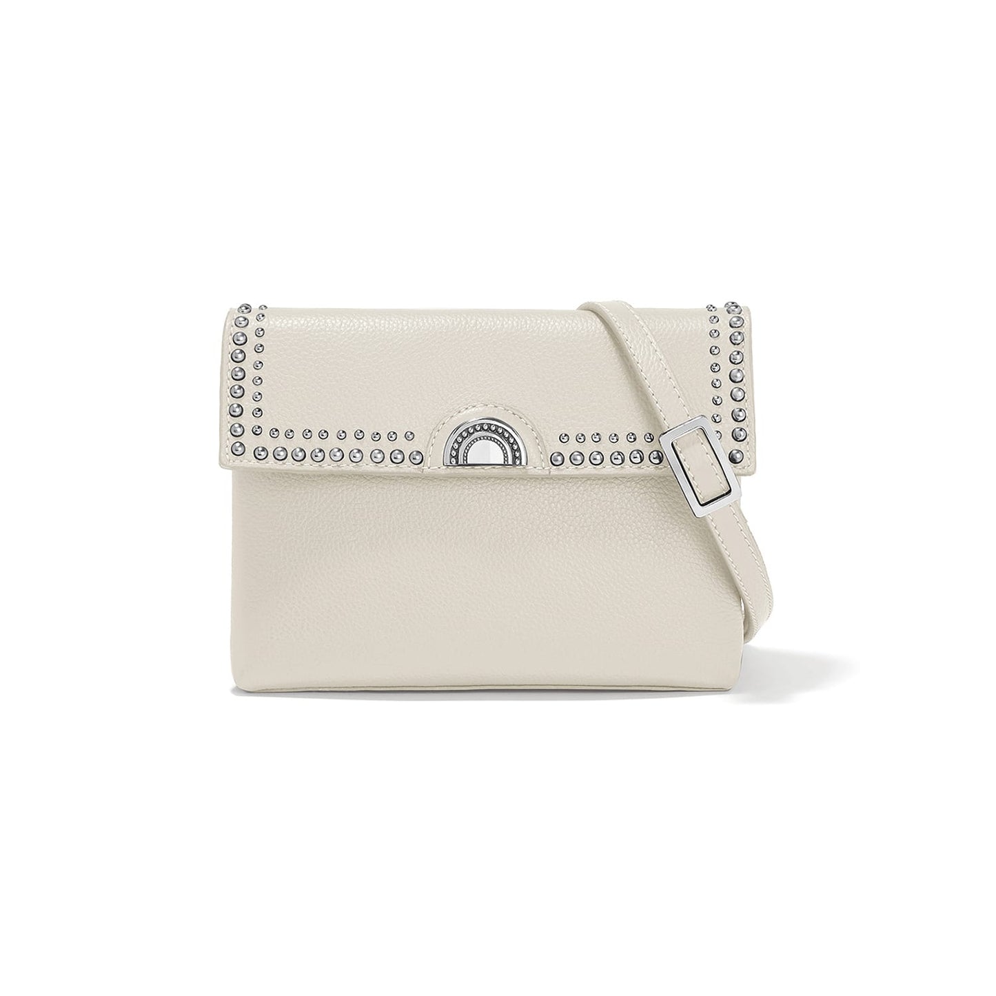 Brighton crossbody handbag in cream leather with studded flap, silver-tone turn-lock clasp, and adjustable strap on a white background