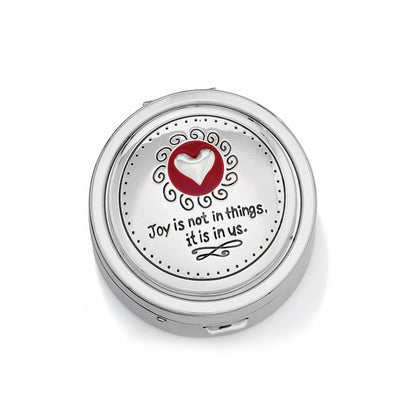 Brighton silver-tone pill box with embossed heart, red enamel accent, and inspirational quote on a white background