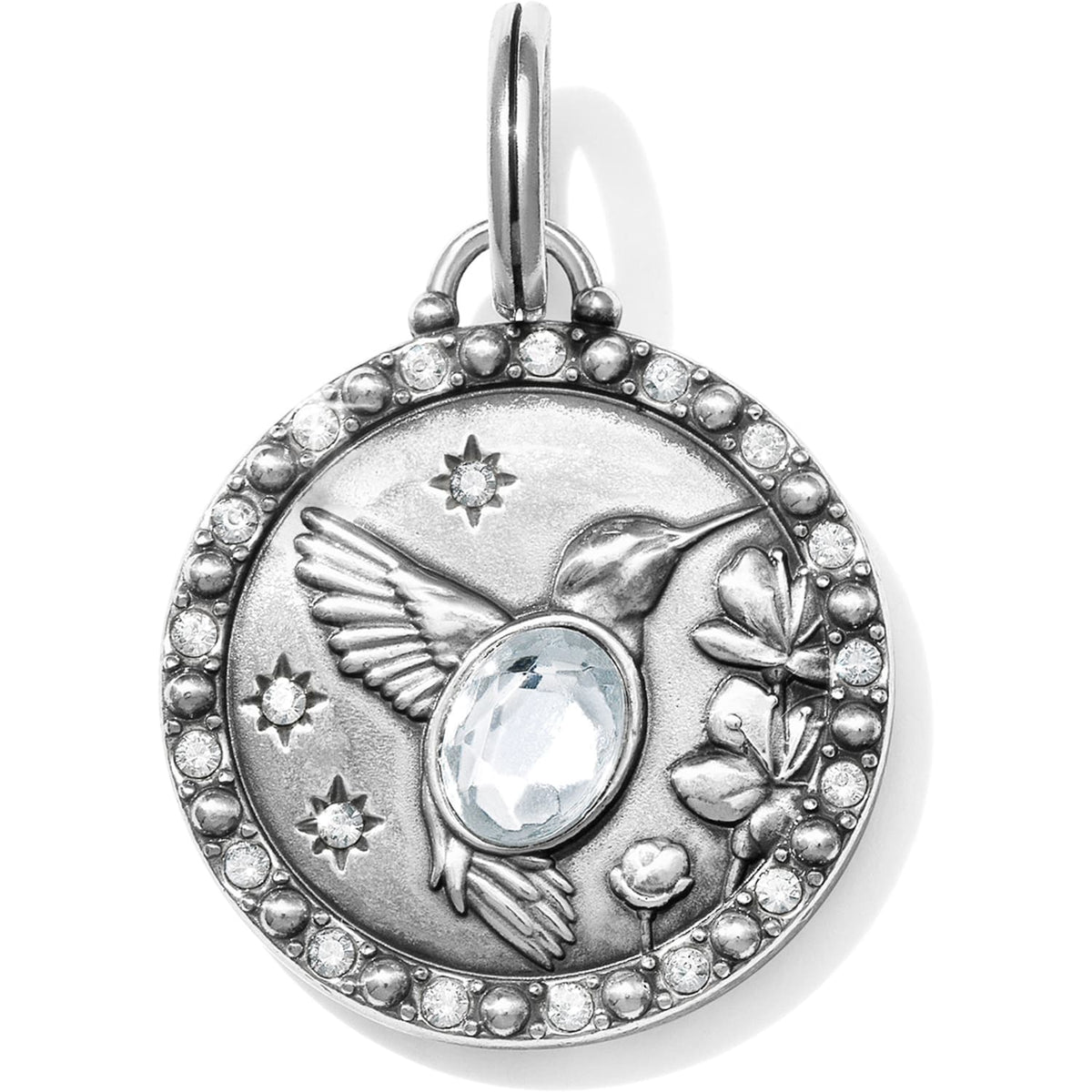 Brighton silver-plated charm pendant with hummingbird, flowers, stars, central crystal, and pave crystal border on a white background