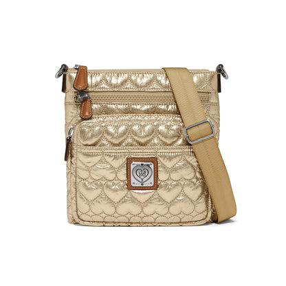 Brighton crossbody handbag in gold quilted heart pattern with adjustable strap and leather trim on a white background