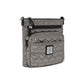 Brighton crossbody handbag in metallic pewter with heart-quilted pattern, front zip pocket, and logo plaque on a white background