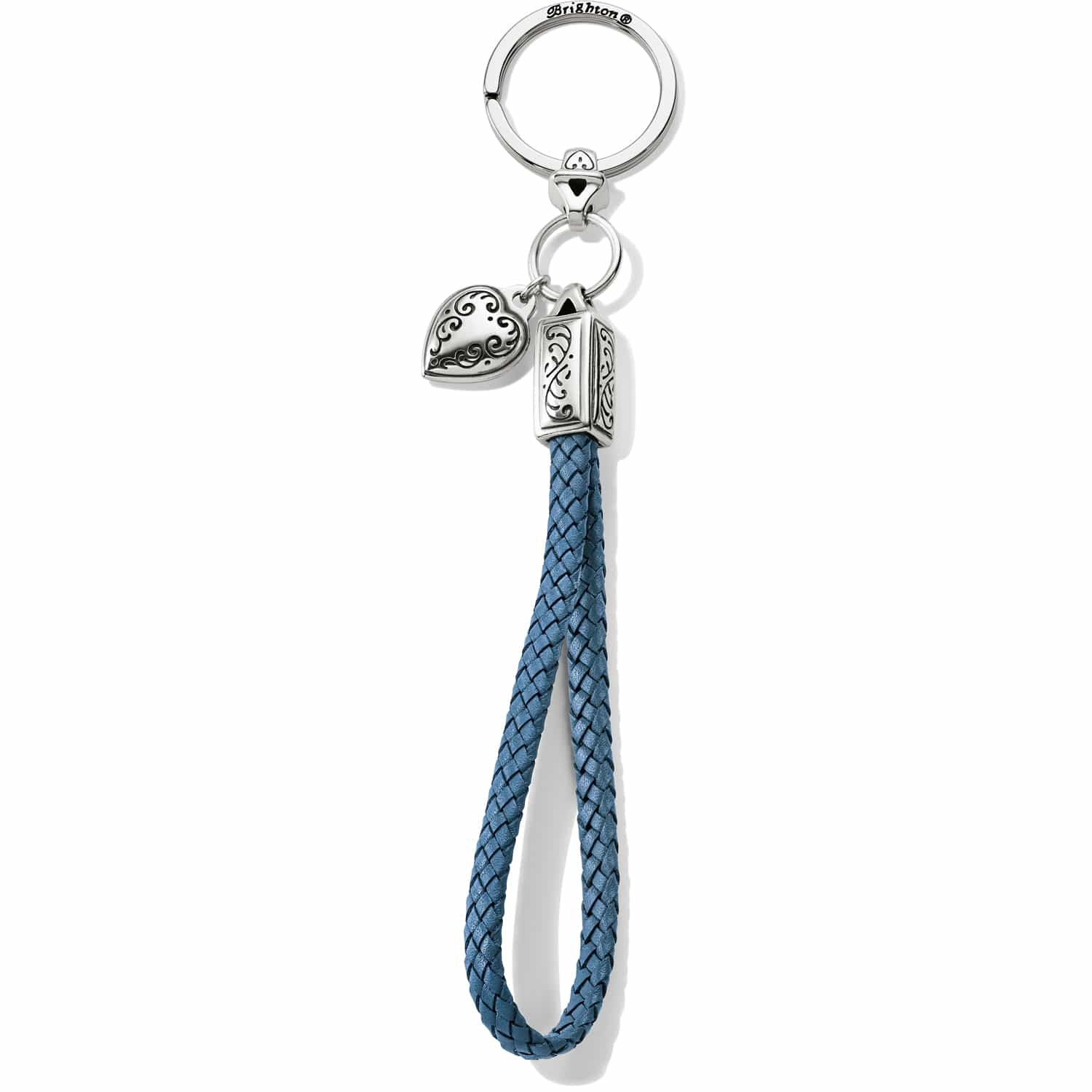 Brighton keychain with blue braided leather loop, silver-plated heart charm, and engraved scroll details on a white background