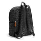 Brighton backpack shown from the back with black quilted heart pattern, adjustable straps, and side zip pocket on a white background