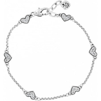 Brighton silver-plated bracelet with crystal-encrusted heart stations and lobster clasp closure on a white background