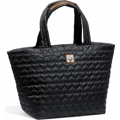 Brighton tote handbag in black quilted heart pattern with dual handles and silver-tone logo plaque on a white background