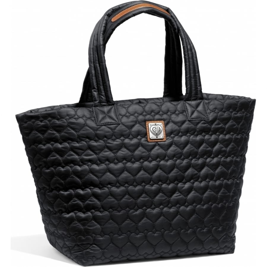 Brighton tote handbag in black quilted heart pattern with dual handles and silver-tone logo plaque on a white background