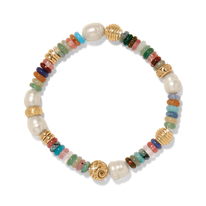 Brighton beaded bracelet with glass pearls, mixed gemstones, dyed jade, and gold-plated accents on a white background