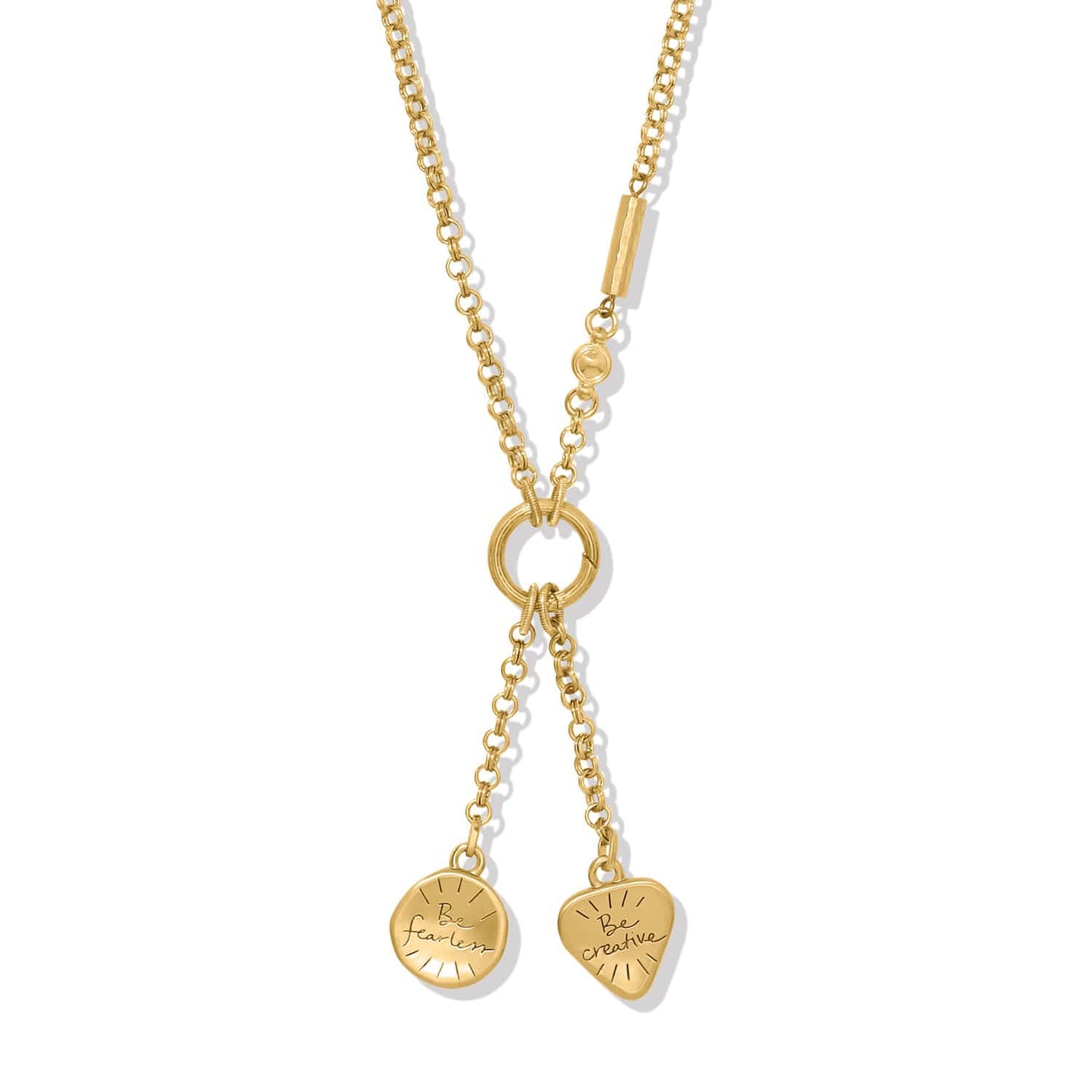 Brighton gold-plated lariat necklace with engraved Be Fearless disc and Be Creative heart charms on a white background