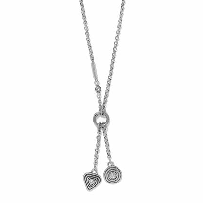 Brighton silver-plated lariat necklace with heart and circle charms featuring crystal accents on a white background