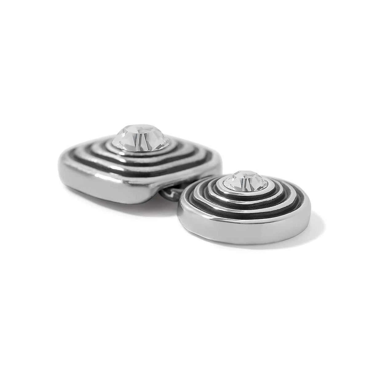 Brighton silver-plated clip earrings with ridged dome design and crystal centers on a white background